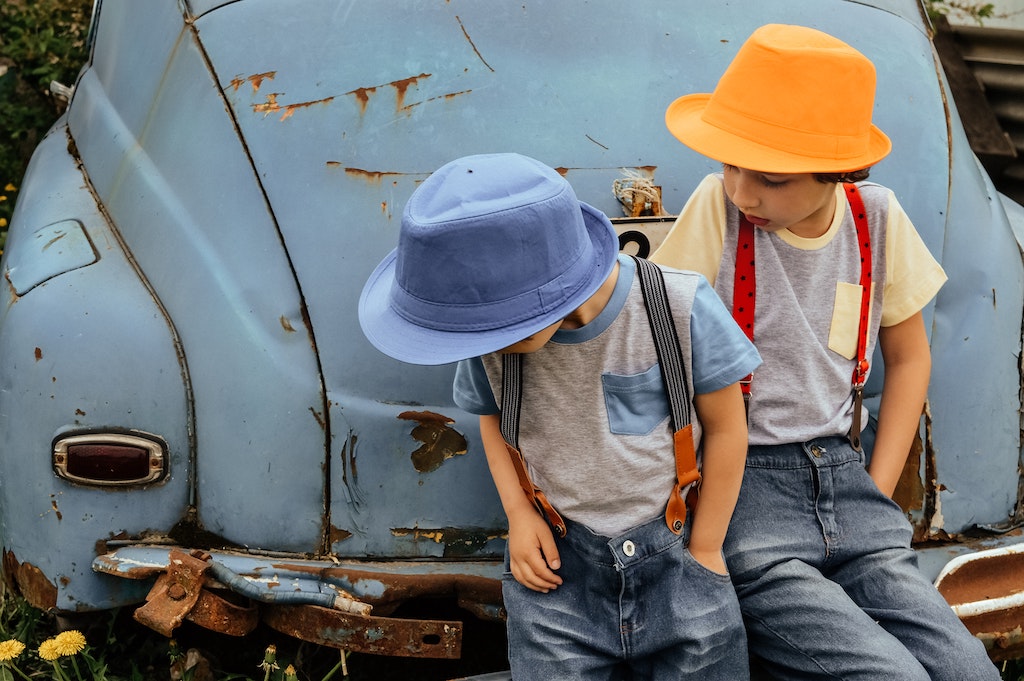 Boys sitting on bumper