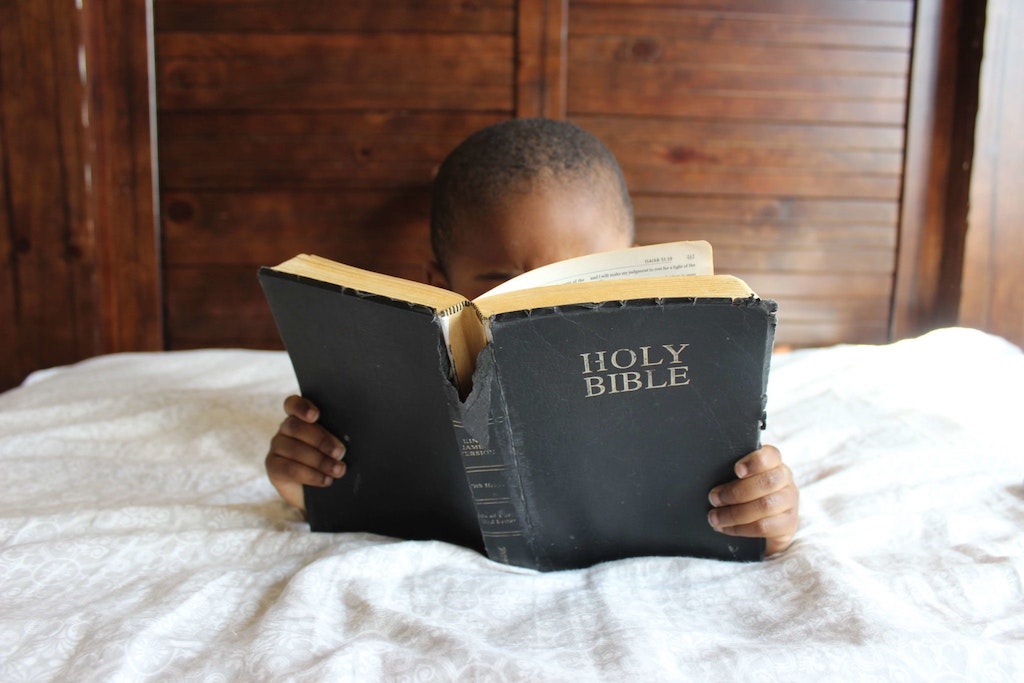 Boy reading Bible